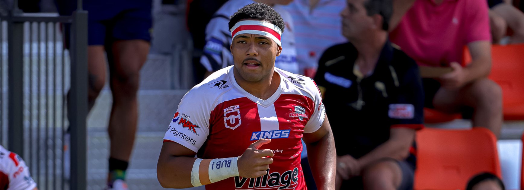 Michael Waqa running on the field for the Auswide Bank Mal Meninga Cup grand final.